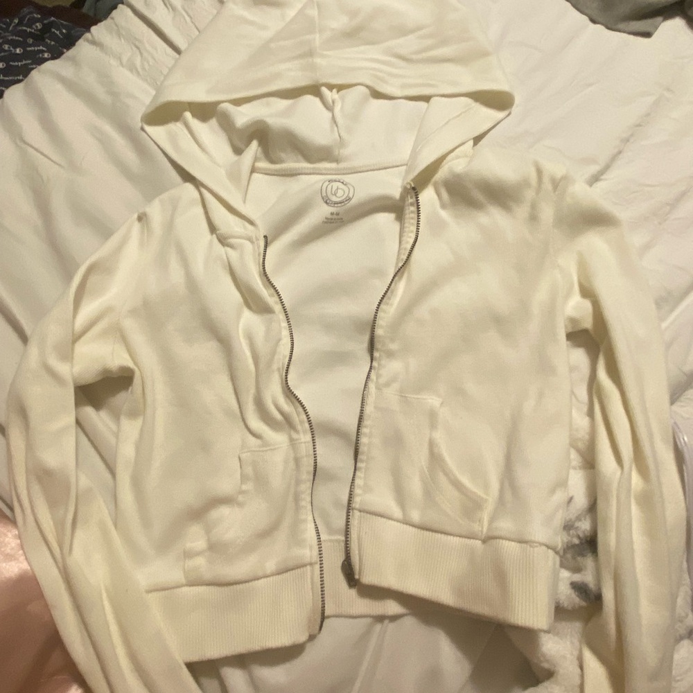 urban outfitters cropped white zip up. size M.